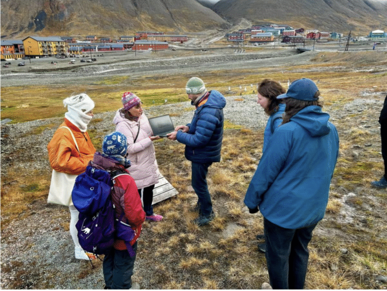 Checking the thaw depth at the excursion in Longyearbyen